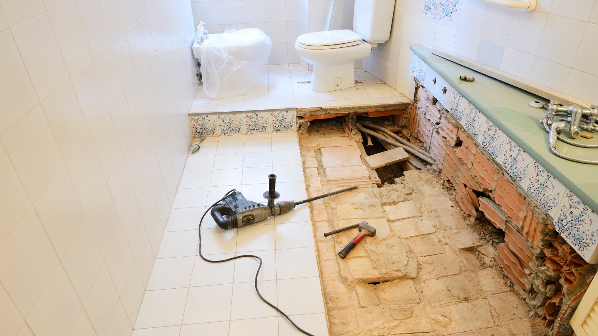 Bathroom demolition showing floor and tile removal during remodel