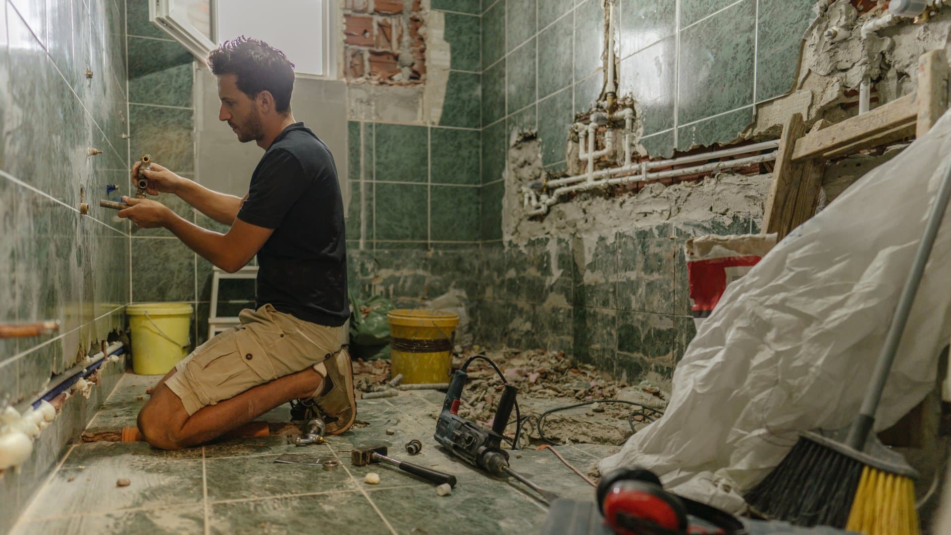 Completed small bathroom remodel with double vanity and marble tile