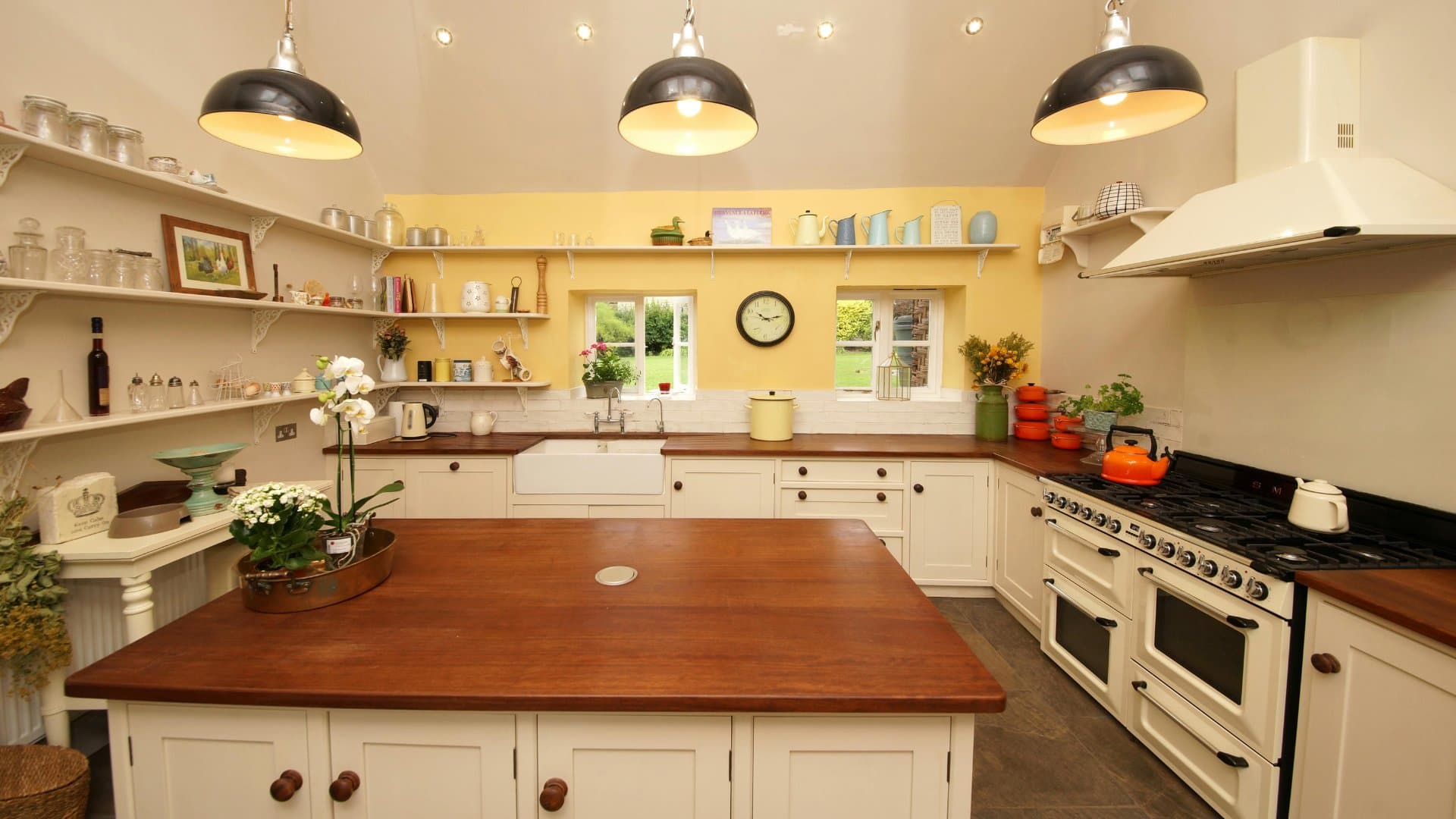 Farmhouse kitchen with butcher block counters and apron sink