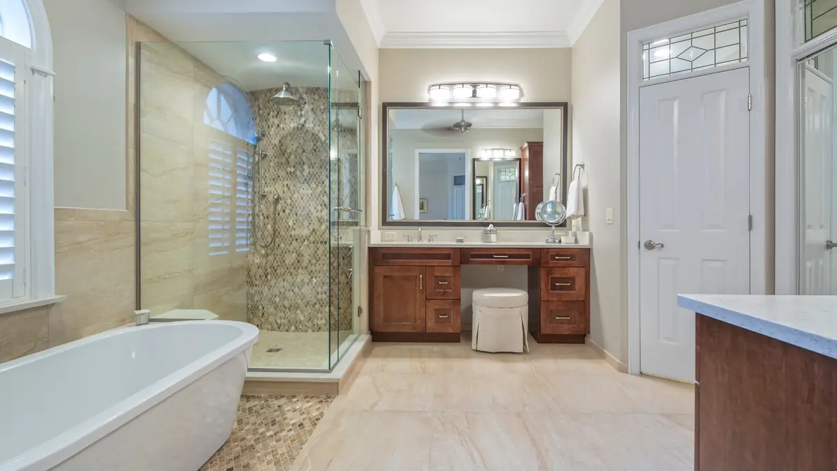 Bathroom glass shower with wood vanity