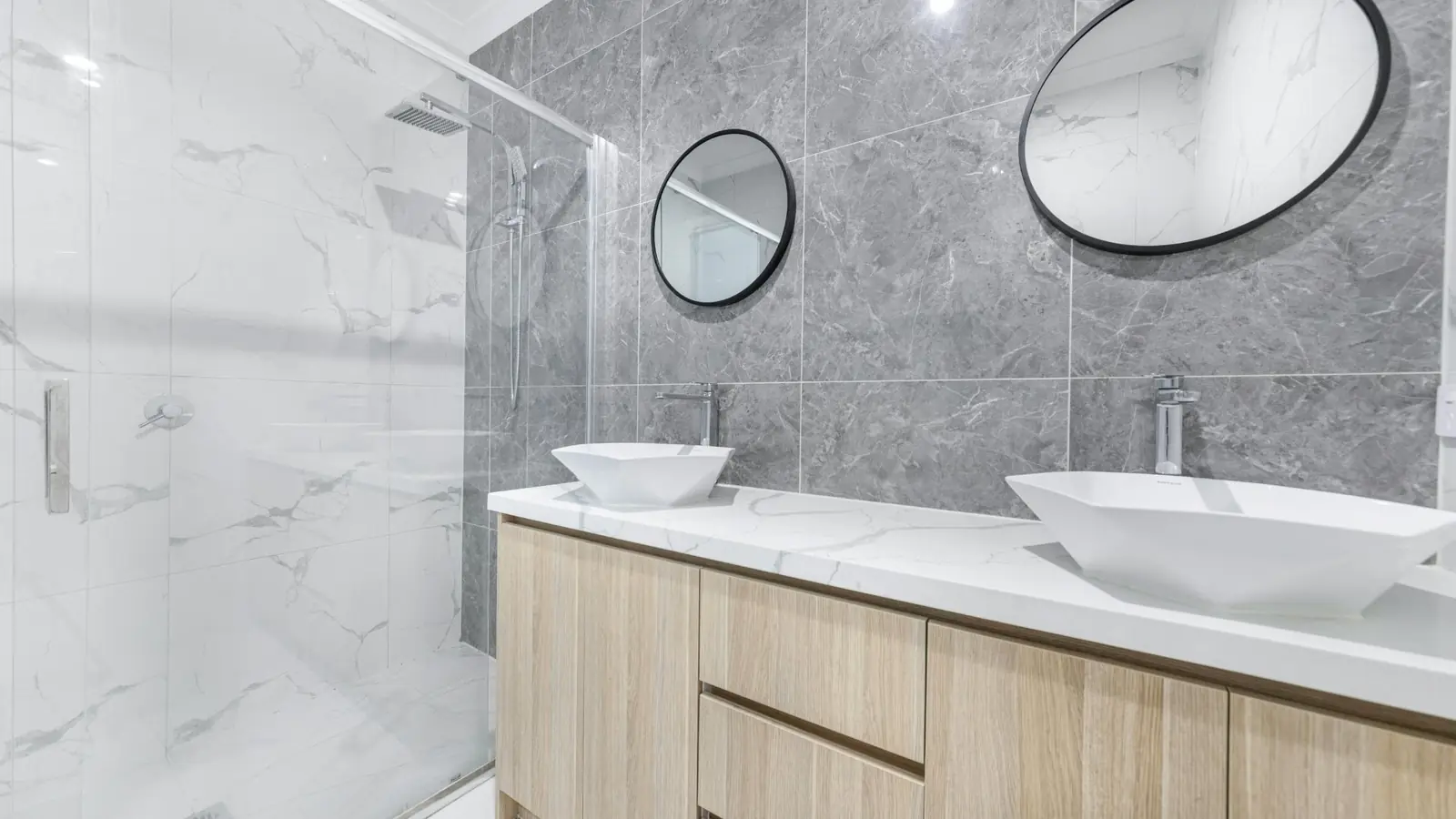 Bathroom remodel with double vessel sinks and grey marble in Albany NY