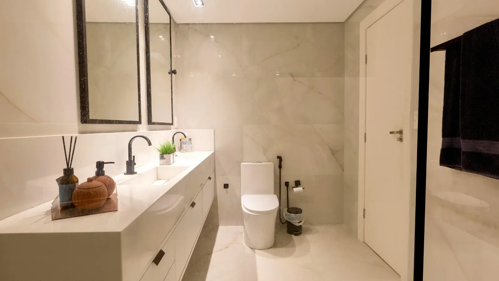 Bathroom renovation with marble tile and floating vanity