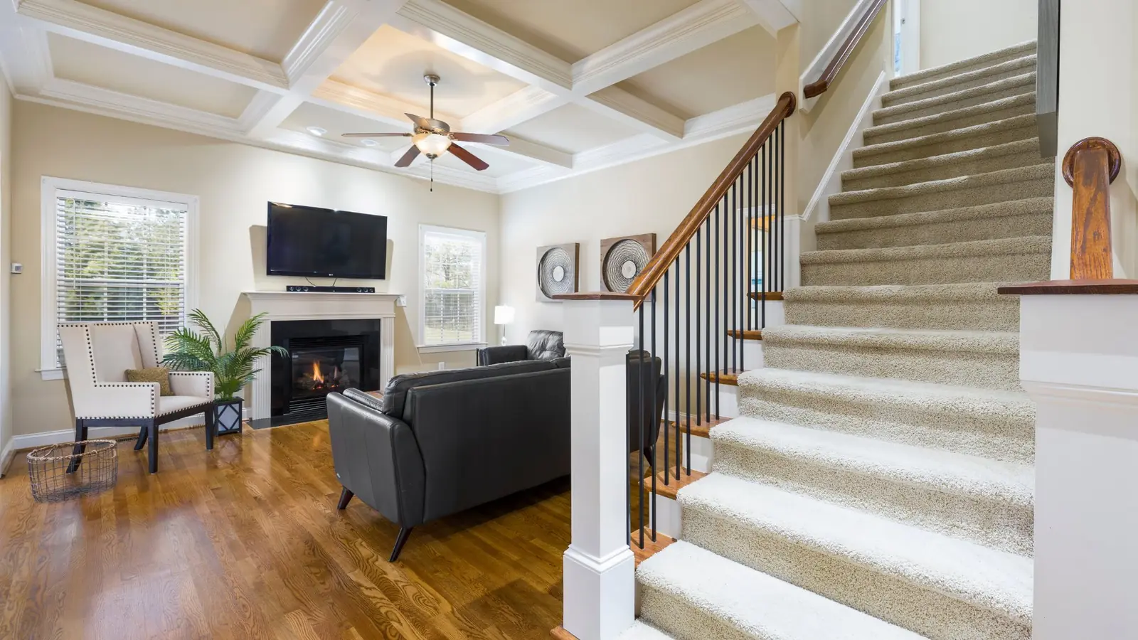Beautiful staircase remodel with custom railing and refinished treads